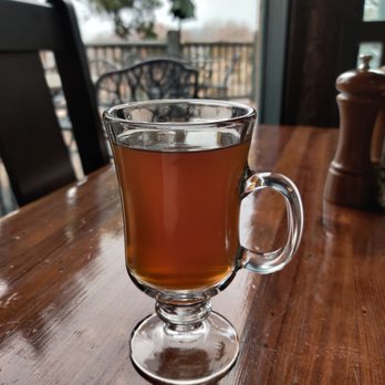Buzzard Bar - a glass of tea on a wooden table - Bars Near Me - Ridgedale, Missouri Buzzard Bar - a glass of tea on a wooden table - Bars Near Me - Ridgedale, Missouri
