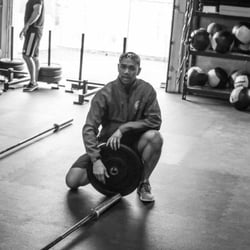 Engineered Bodies Strength & Conditioning - Anthony setting up the CrossFit demo workout.