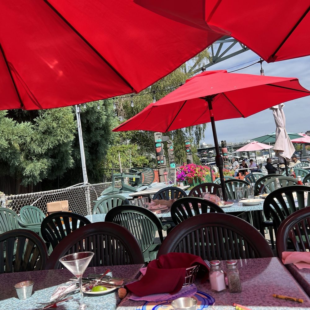 Ivar's Fish Bar - tables with red umbrellas - Seafood Near Me - Seattle, Washington Ivar's Fish Bar - tables with red umbrellas - Seafood Near Me - Seattle, Washington