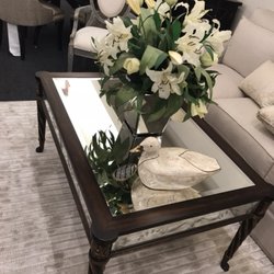 Classic Home Furnishings - EJ Victor mirrored cocktail table and floral on top of custom hand made area rug