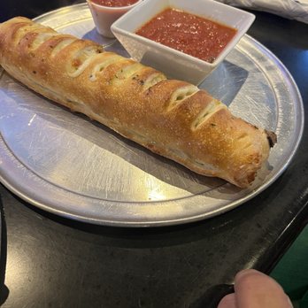 The Corner Pizza Bar - Small Stromboli with pepperoni, sausage, spinach - Italian Near Me - Orlando, Florida The Corner Pizza Bar - Small Stromboli with pepperoni, sausage, spinach - Italian Near Me - Orlando, Florida