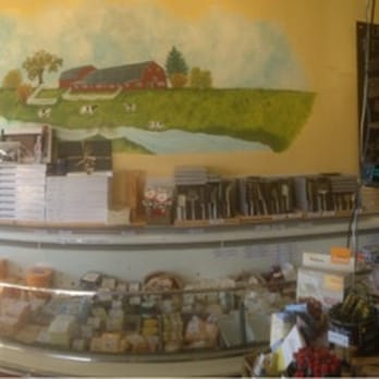 Springbank Cheese Company - Panorama shot capturing only half of the cheese selection! - Cheese Shops Near Me - Calgary, Alberta