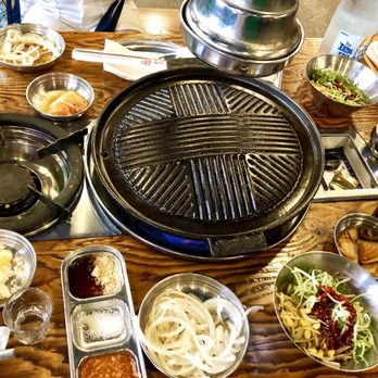 Jongro BBQ - Cast iron grill, Pork platter with refillable banchans - Korean Near Me - New York, New York Jongro BBQ - Cast iron grill, Pork platter with refillable banchans - Korean Near Me - New York, New York