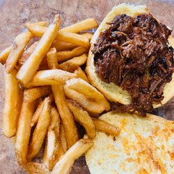 Smokehouse beef brisket comes with 1 side slaw/beans/wild rice/applesauce/veg of day. upgrade to fries $1.99/sweet potato fries $2.99
