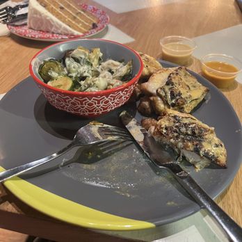 Nando's Peri-Peri - Chicken thighs, Brussels, carrot cake - South African Near Me - Reston, Virginia Nando's Peri-Peri - Chicken thighs, Brussels, carrot cake - South African Near Me - Reston, Virginia