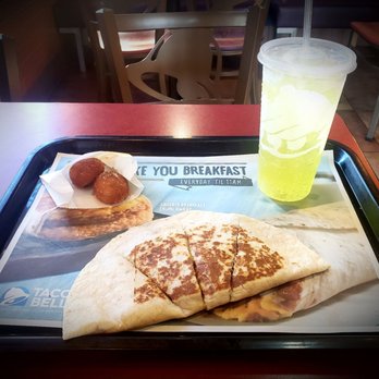 Taco Bell - Breakfast Steak egg quesadilla with cinnamon balls and a refreshing MD. - Fast Food Near Me - Tampa, Florida