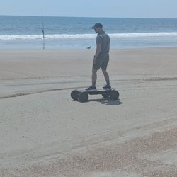 Amelia Island Board Rentals - Husband enjoying zipping down the beach on the electric skateboard!