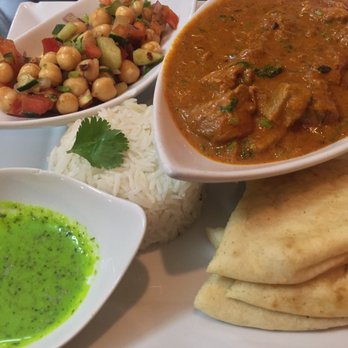 Cilantro Indian Cafe - Lamb korma with basmati rice, chickpea salad, buttery naan and spicy cilantro sauce - Indian Near Me - Cary, North Carolina Cilantro Indian Cafe - Lamb korma with basmati rice, chickpea salad, buttery naan and spicy cilantro sauce - Indian Near Me - Cary, North Carolina