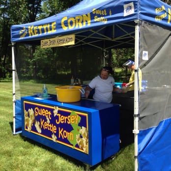 Sweet Jersey Kettle Korn - a man sitting under a blue tent - Street Vendors Near Me - Monroe, New Jersey Sweet Jersey Kettle Korn - a man sitting under a blue tent - Street Vendors Near Me - Monroe, New Jersey