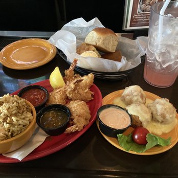 Barbara Jean's Restaurants - Dirty Rice, Coconut Shrimp, grit bomb appetizer, pink lemonade served at the Bar. - Southern Near Me - St. Simons, Georgia