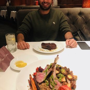 Fleming’s Prime Steakhouse & Wine Bar - Plate in front is the seasonal Lamb Bowl while the cutie in front of me got the Main Filet Mignon - Steakhouses Near Me - Tucson, Arizona