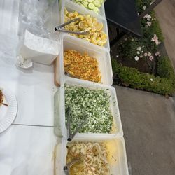 Tacos El Primo - Fixings, 3 different salsas, cucumbers, pineapple and habanero salad, cilantro and onion, and pickles onions.