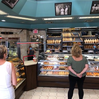 Caputo's Pastry Shoppe - a woman standing in front of the counter - Bakeries Near Me - Long Branch, New Jersey Caputo's Pastry Shoppe - a woman standing in front of the counter - Bakeries Near Me - Long Branch, New Jersey