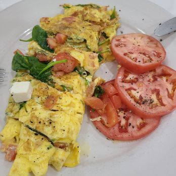 Poppies Restaurant & Deli - Greek omelet with tomatoes (and a pumpernickel bagel, not pictured) - Delis Near Me - Delray Beach, Florida Poppies Restaurant & Deli - Greek omelet with tomatoes (and a pumpernickel bagel, not pictured) - Delis Near Me - Delray Beach, Florida