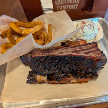 Rocklands Barbeque and Grilling- Arlington - Beef ribs, potato salad, onion rings and cornbread (not pictured). Try ALL OF IT - Barbeque Near Me - Arlington, Virginia