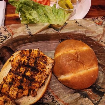 Roosters - Cajun Chicken sandwich with the topping on the side. - Burgers Near Me - Lexington, Kentucky