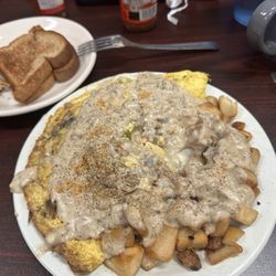 Gigi's Country Kitchen - The Bomelet smothered in gravy with home fries!