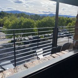 Grizzly Hackle Fly Shop - View from the pack deck overlooking the River, carousel and where they have a great farmers market on Sunday.
