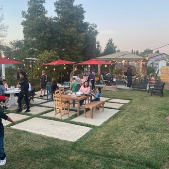 15 Oh Five - a group of people sitting at tables in a backyard - Cafes Near Me - National City, California