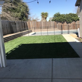 New Vision Landscape - a backyard with artificial grass - Landscaping Near Me New Vision Landscape - a backyard with artificial grass - Landscaping Near Me