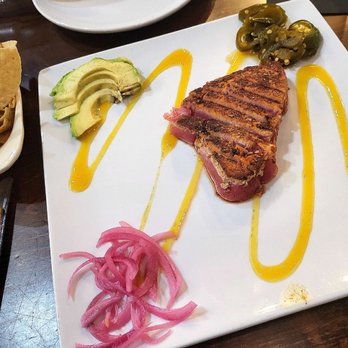 Texas Bistro - Blackened tuna tartar appetizer with tortilla chips - New American Near Me - New Braunfels, Texas Texas Bistro - Blackened tuna tartar appetizer with tortilla chips - New American Near Me - New Braunfels, Texas