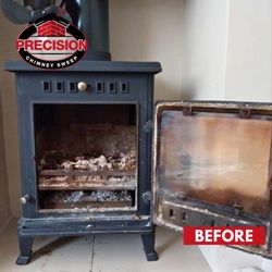 Precision Chimney Sweep - BEFORE: Dirty wood stove interior with ash and residue build-up before cleaning