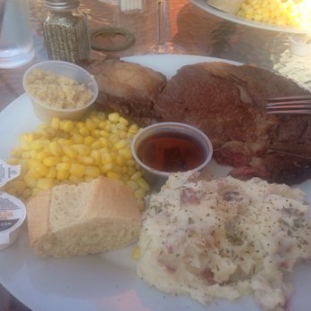Mountain Spirits Tavern - a plate of meat, mashed potatoes, corn, bread, and sauce - Pubs Near Me - Newbury, New Hampshire