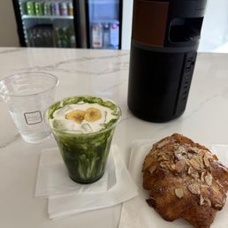 Almond croissant and iced banana matcha Almond croissant and iced banana matcha
