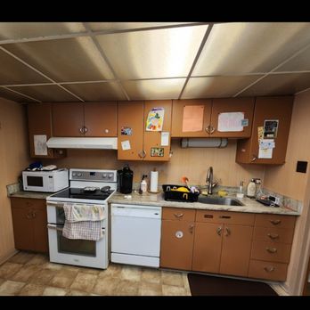 Moller Builders - Before..metal cabinets, 1970 era ceiling and lights, limited counter space. - General Contractors Near Me