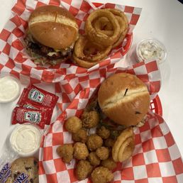 Blues Bacon burger with fried mushrooms and a Mikes special deluxe burger with onion rings with two sides of house made ranch. Blues Bacon burger with fried mushrooms and a Mikes special deluxe burger with onion rings with two sides of house made ranch.