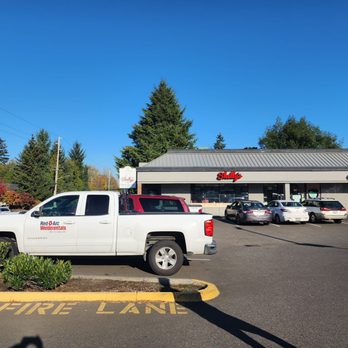 Shelly's - a white truck parked in a parking lot - American Near Me - Burien, Washington Shelly's - a white truck parked in a parking lot - American Near Me - Burien, Washington