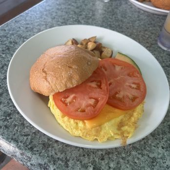 RC Otters Island Eats - Tomato egg and cheese sandwich with home fries and fruit - Breakfast & Brunch Near Me - Captiva Island, Florida