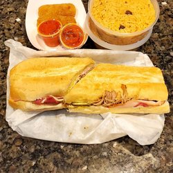 El Cuba Cafe - Cuban Sandwich, Ham Croquettes with homemade hit sauce (2 already eaten before picture) and 2 side of rice.