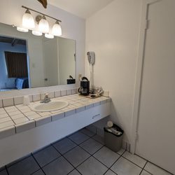 Discovery Inn - Outside of the bathroom there is the sink area