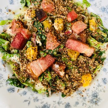 Odd Duck - Grilled kale salad, pork belly, citrus, sunflower dukkah, shitake ranch - American Near Me - Austin, Texas Odd Duck - Grilled kale salad, pork belly, citrus, sunflower dukkah, shitake ranch - American Near Me - Austin, Texas
