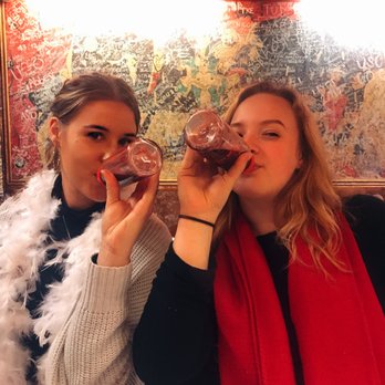 Refuge des Fondues - Birthday girl and I enjoying wine out of baby bottles! - Fondue Near Me - Paris, 75