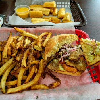 Sanguche - Chicharron sandwiches with fried yuca - Peruvian Near Me - Naperville, Illinois Sanguche - Chicharron sandwiches with fried yuca - Peruvian Near Me - Naperville, Illinois
