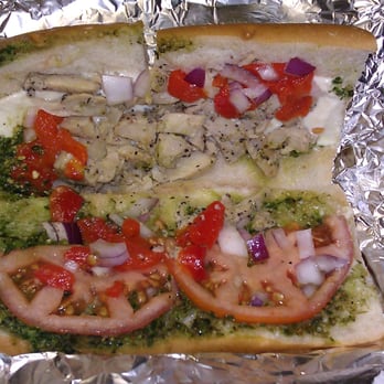 Planet Smoothie - The Basil Chicken Panini opened up so you cas see all the goodies they put in it. - Juice Bars & Smoothies Near Me - Honolulu, Hawaii