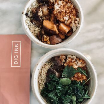 Dig Inn - two bowls of food on a table - New American Near Me - New York, New York Dig Inn - two bowls of food on a table - New American Near Me - New York, New York