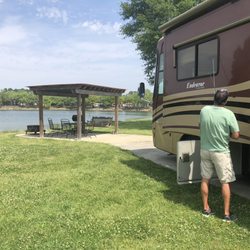 Lafayette KOA - Our site with covered patio and lake .