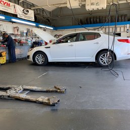 a car being repaired in a garage a car being repaired in a garage
