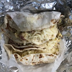 Three different breakfast tacos, all excellent