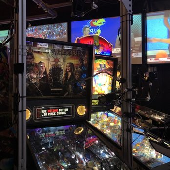 Magoos - a row of pinball machines in a game room - Pool Halls Near Me - Tulsa, Oklahoma