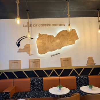 Raha Coffee House - Some seating and decor explaining the origins of some of the coffees they offer - Coffee & Tea Near Me - Buffalo, New York Raha Coffee House - Some seating and decor explaining the origins of some of the coffees they offer - Coffee & Tea Near Me - Buffalo, New York