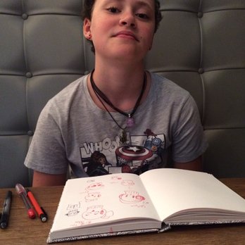 Bareburger - Short North - The kiddo in our booth doing some drawing while we wait for our burgers. - Burgers Near Me - Columbus, Ohio