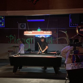 The Playground - a man playing pool at a bar - Sports Bars Near Me - Reno, Nevada The Playground - a man playing pool at a bar - Sports Bars Near Me - Reno, Nevada