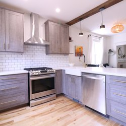 Livingston Cabinetry - Beautiful custom kitchen cabinets designed and built by Livingston Cabinetry. A reclaimed barn beam divides the kitchen and livingroom