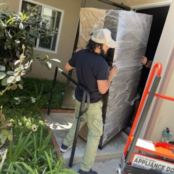 Mowglis Trusted Movers - Dan directing the angling of the armoire so carefully with Vlad into my sister's front door - Movers Near Me - Los Angeles, California Mowglis Trusted Movers - Dan directing the angling of the armoire so carefully with Vlad into my sister's front door - Movers Near Me - Los Angeles, California