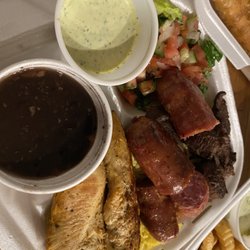 Brazilicious - Chicken, sausage, steak, black beans, yellow rice, and salad.