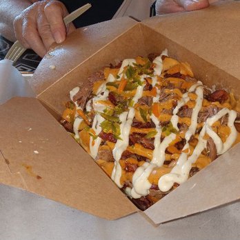 Tortuga Sandwich Shop - Kenmore - Our 420 Fries came in a box on the tray. After we emptied it onto the tray it didn't look this attractive.  Understatement. - Latin American Near Me - Kenmore, New York